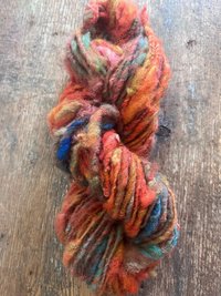Mischievious - handspun local wool art yarn, orange with green, blue and pink