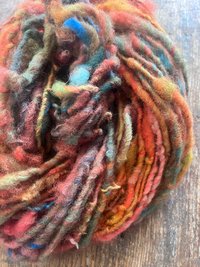 Mischievious - handspun local wool art yarn, orange with green, blue and pink