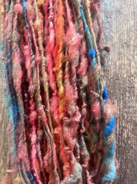 Mischievious - handspun local wool art yarn, orange with green, blue and pink