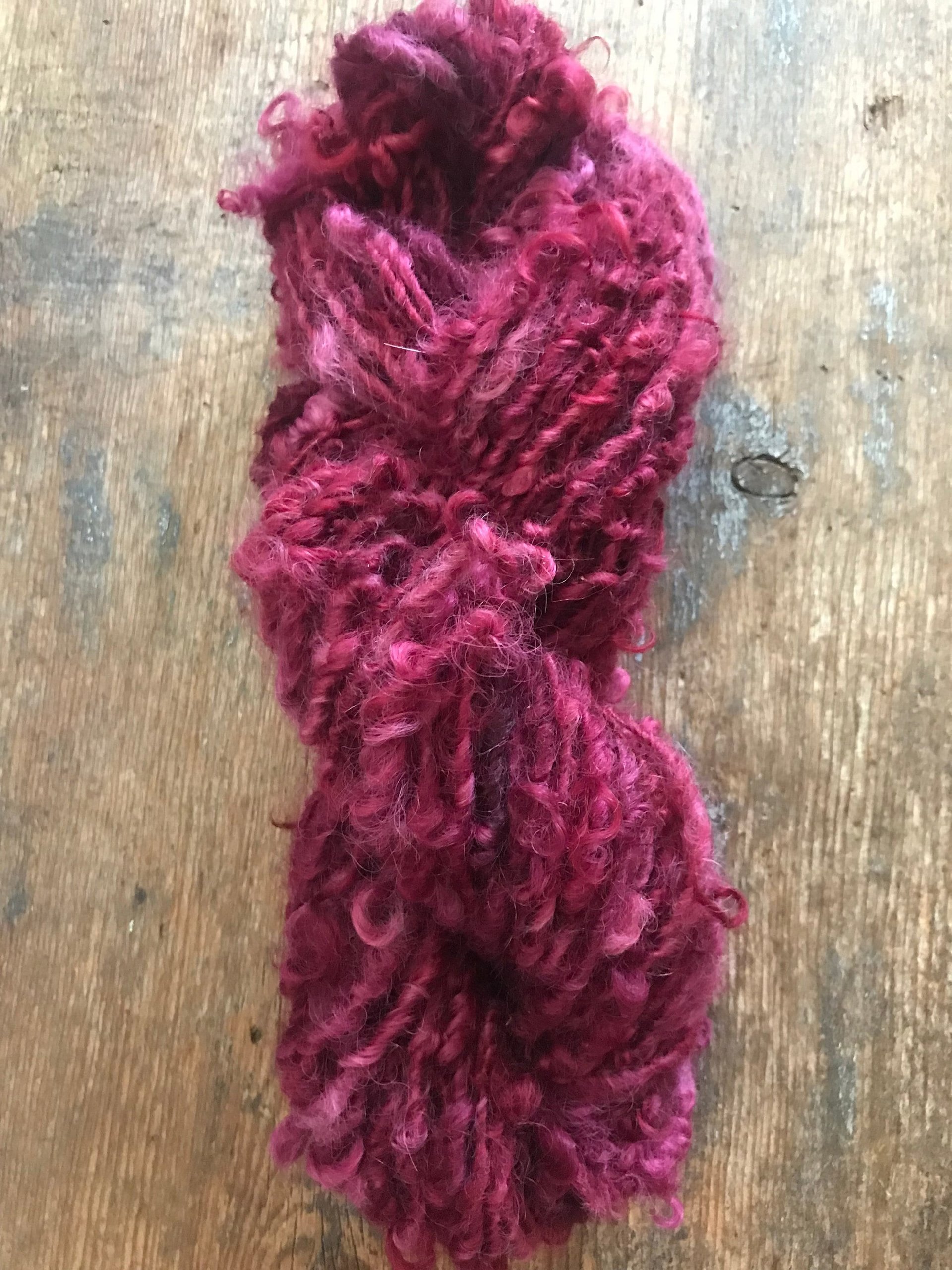 Merrily We Roll Along, burgundy curly 20 yards handspun yarn