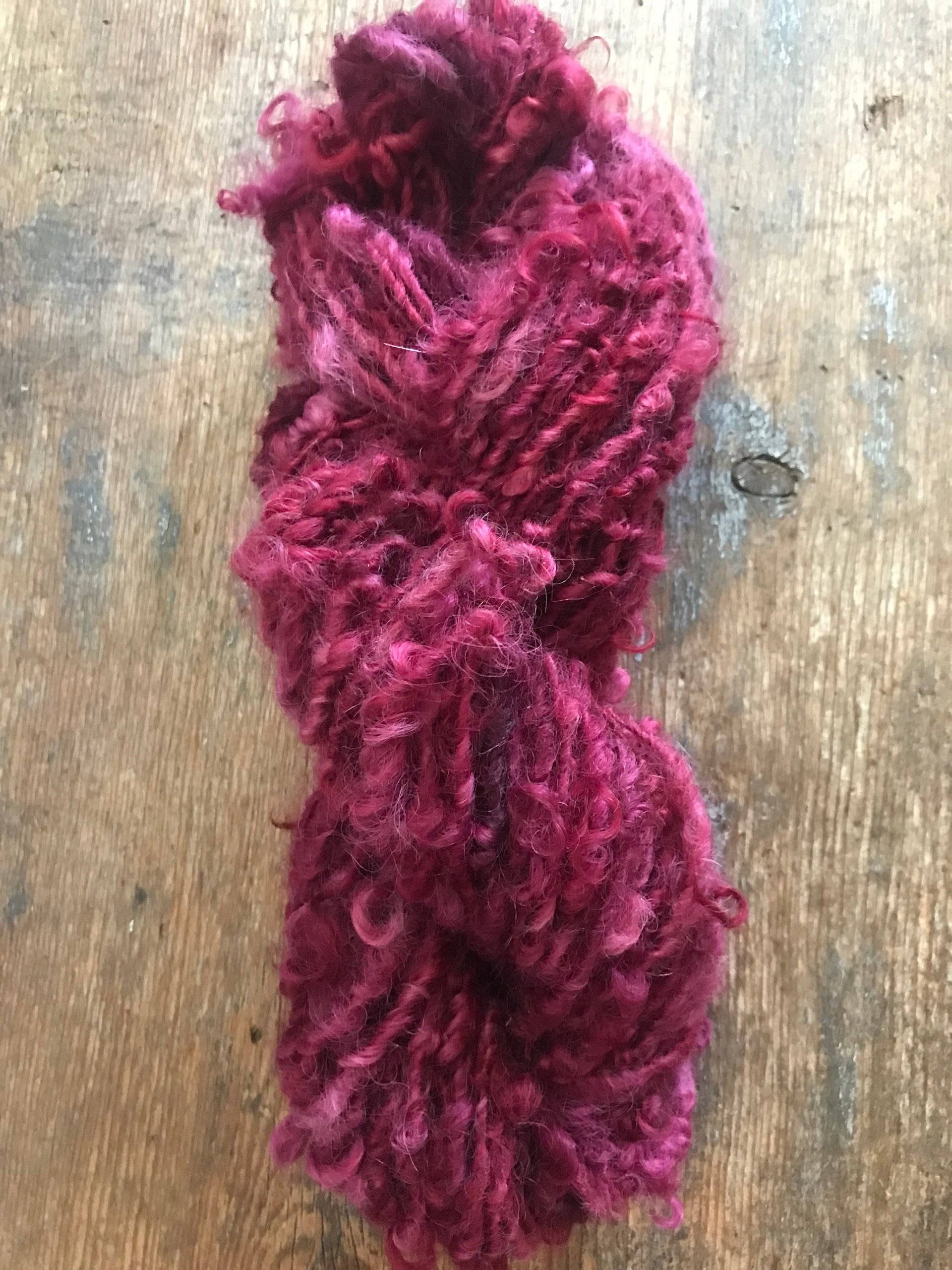 Merrily We Roll Along, burgundy curly 50 yards handspun yarn