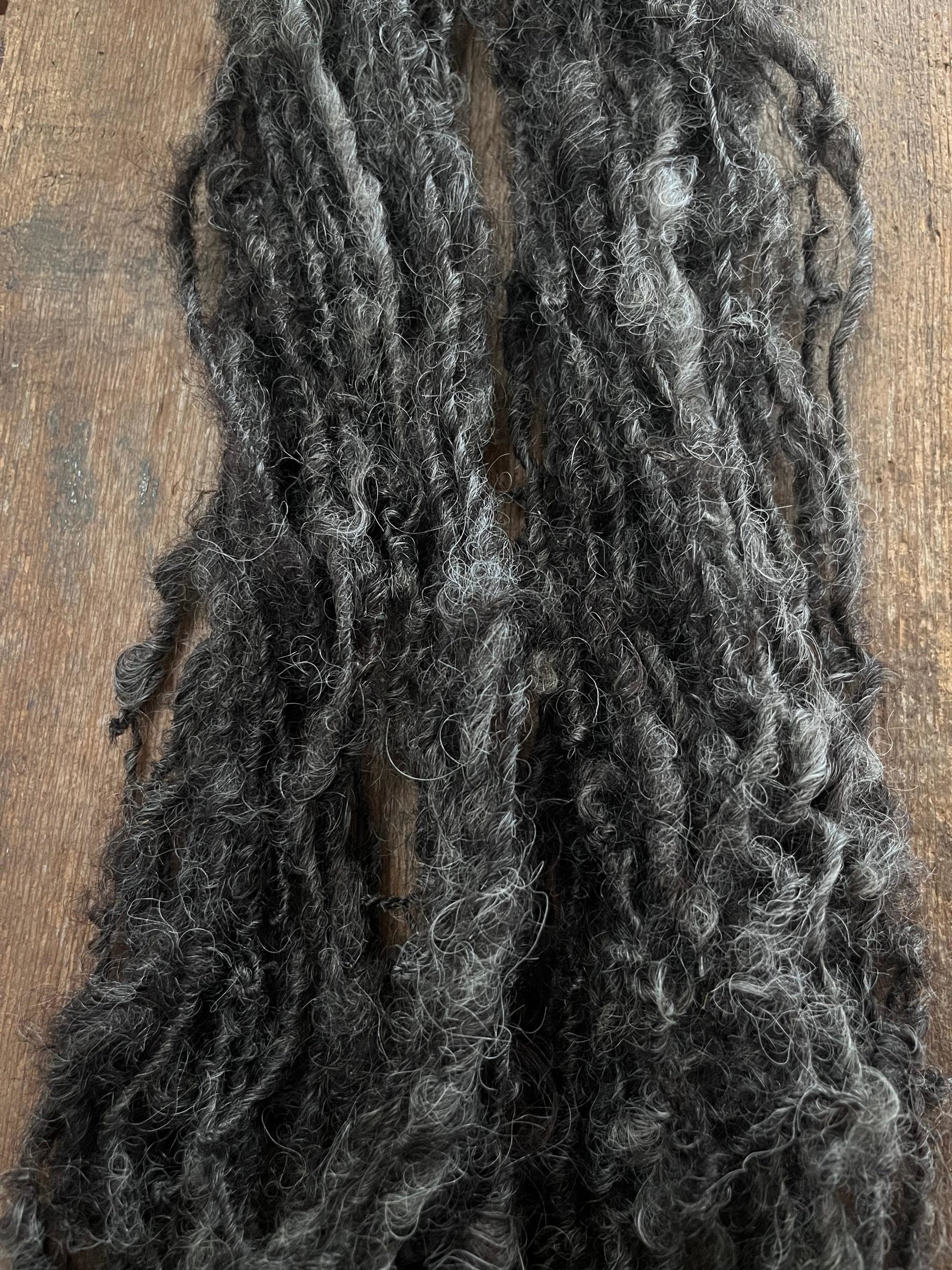 Charcoal grey Lincoln wool yarn, lockspun curly art yarn