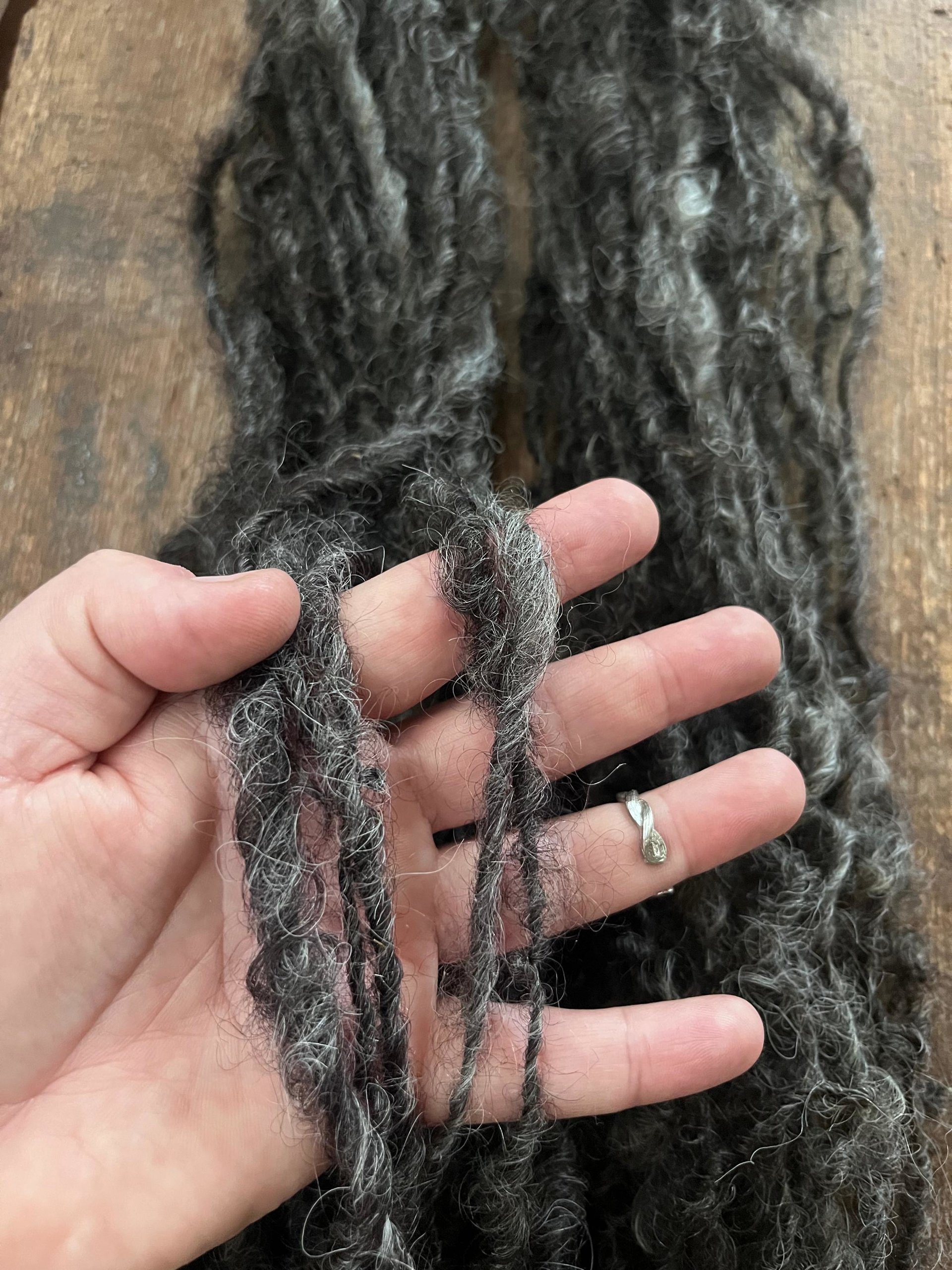 Charcoal grey Lincoln wool yarn, lockspun curly art yarn