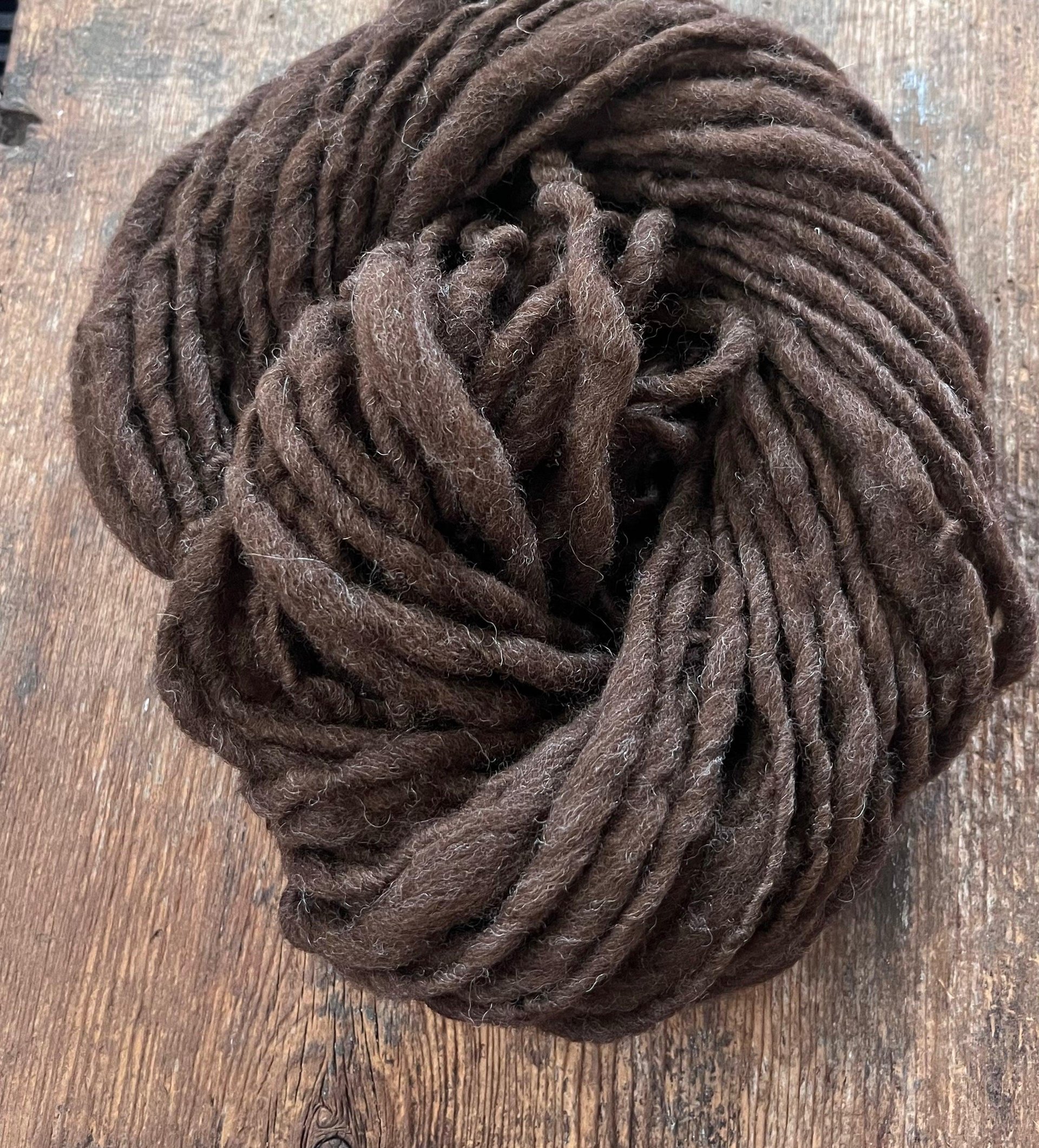 Dark brown Falkland wool, handspun bulky weight. Soft and squishy