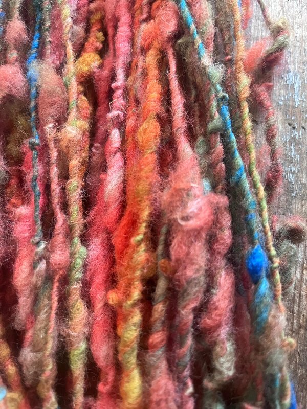 Mischievious - handspun local wool art yarn, orange with green, blue and pink